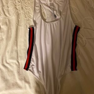 Body suit with black and red stripes on the side
